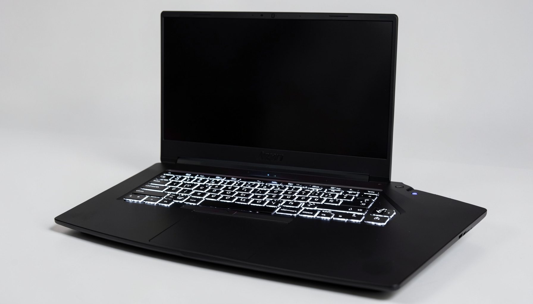 Black Lenovo Legion laptop with white-backlit keyboard, clean gaming design